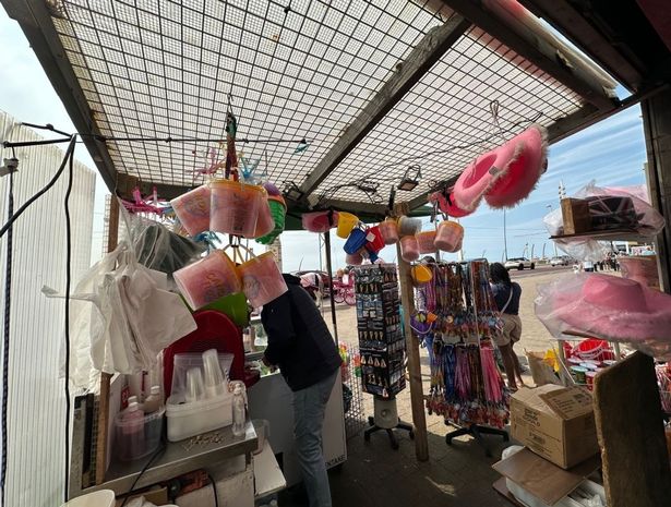 The stall is selling buckets and spades for families with small kids to buy to play on the beach