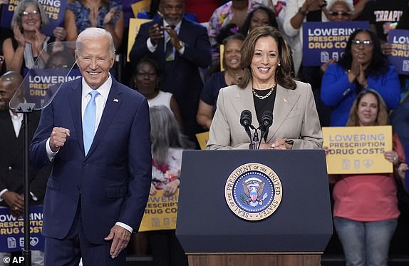 FILE - President Joe Biden, left, and Vice President Kamala Harris speak in Largo, Md., Aug. 15, 2024. (AP Photo/Stephanie Scarbrough, File)