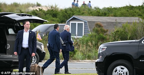 US President Joe Biden (R) arrives to board Marine One to depart from Gordon's Pond State Park, on September 2, 2024 in Rehoboth Beach, Delaware. (Photo by Jim WATSON / AFP) (Photo by JIM WATSON/AFP via Getty Images)