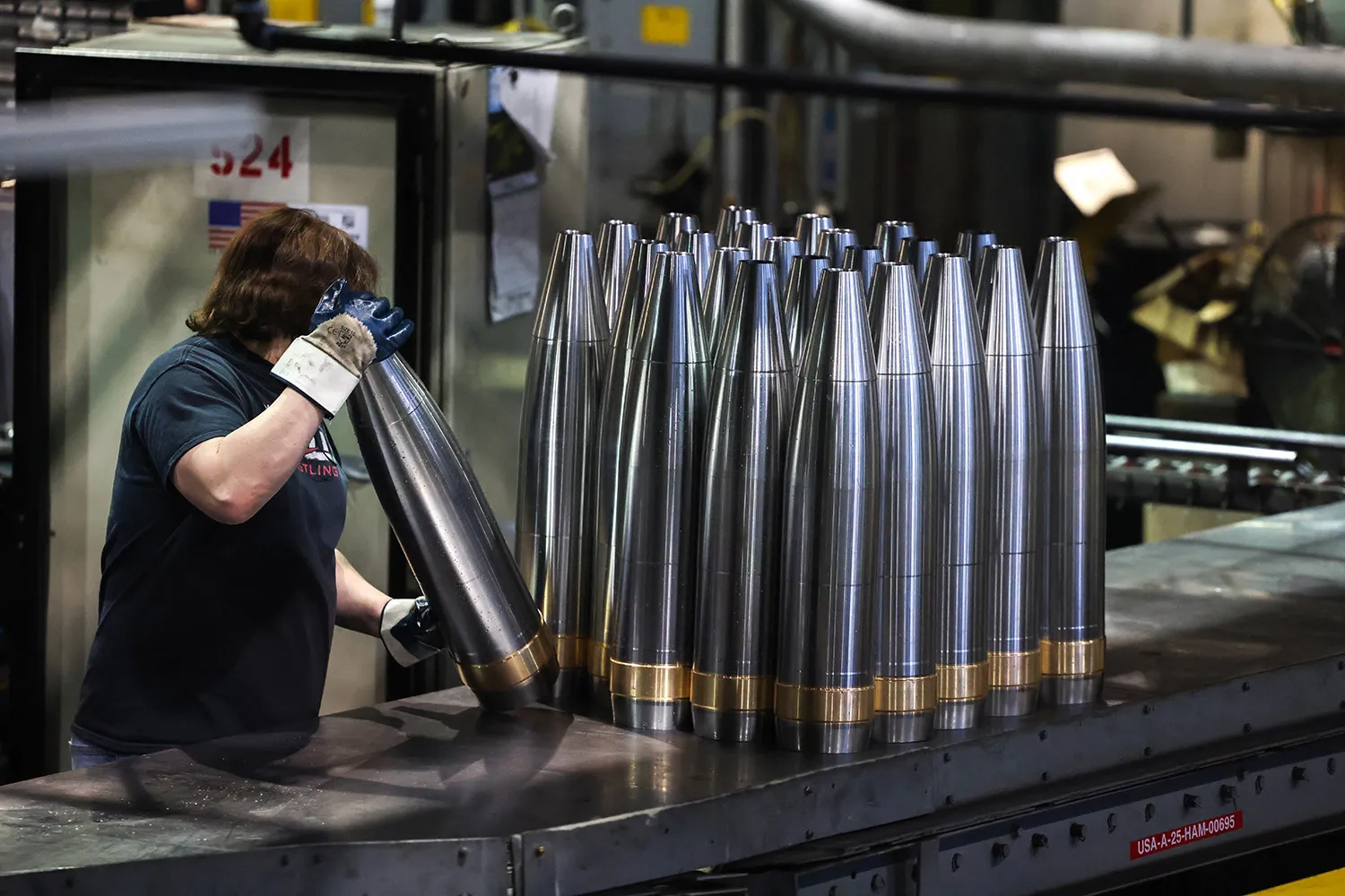 An employee moves 155 mm caliber shells at the Scranton Army Ammunition Plant in Scranton, Pennsylvania.