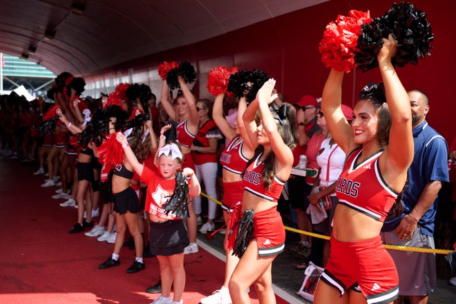 Sep 21, 2024; Louisville, Kentucky, USA; The Louisville Cardinals cheerleaders perform before the Card March prior to a game against the Georgia Tech Yellow Jackets at L&N Federal Credit Union Stadium. Mandatory Credit: Jamie Rhodes-Imagn Images