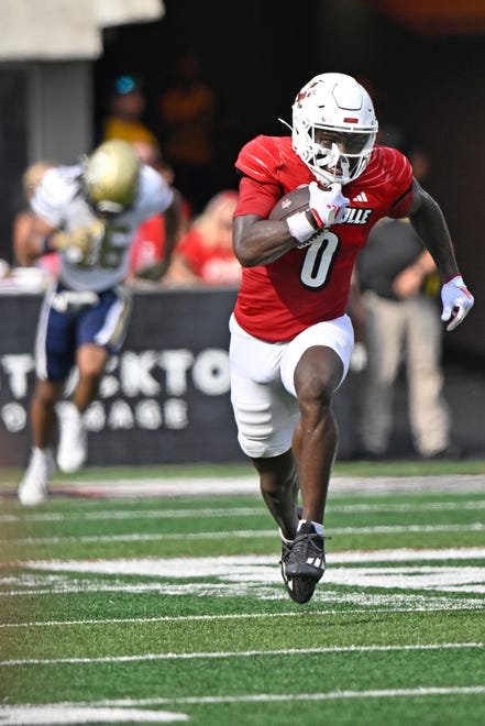 Sep 21, 2024; Louisville, Kentucky, USA; Louisville Cardinals wide receiver Chris Bell (0) runs the ball against the Georgia Tech Yellow Jackets during the first half at L&N Federal Credit Union Stadium. Mandatory Credit: Jamie Rhodes-Imagn Images