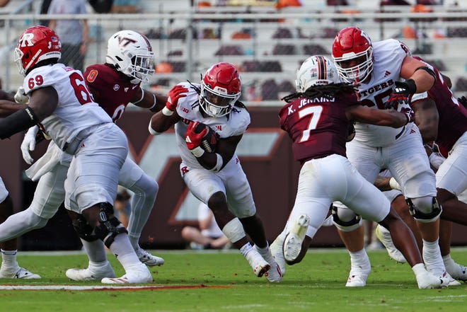 Sep 21, 2024; Blacksburg, Virginia, USA; Rutgers Scarlet Knights running back Kyle Monangai (5) runs the ball during the second quarter against the Virginia Tech Hokies at Lane Stadium. Mandatory Credit: Peter Casey-Imagn Images