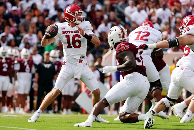 Sep 21, 2024; Blacksburg, Virginia, USA; Rutgers Scarlet Knights quarterback Athan Kaliakmanis (16) throws a pass during the first quarter against the Virginia Tech Hokies at Lane Stadium. Mandatory Credit: Peter Casey-Imagn Images