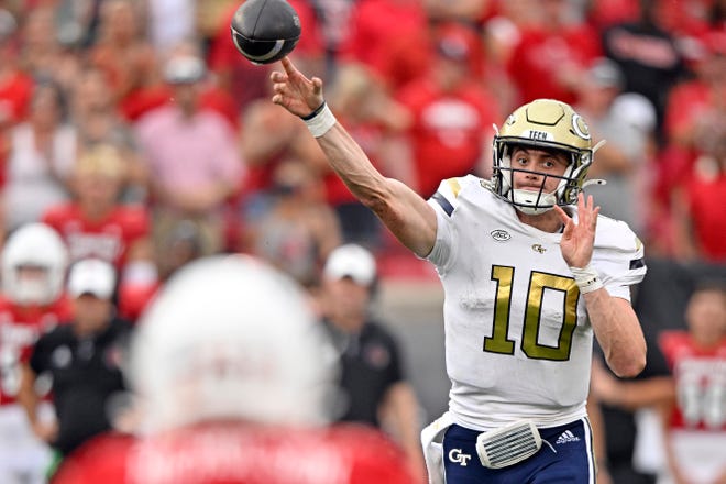 Sep 21, 2024; Louisville, Kentucky, USA; Georgia Tech Yellow Jackets quarterback Haynes King (10) attempts a pass against the Louisville Cardinals during the second half at L&N Federal Credit Union Stadium. Mandatory Credit: Jamie Rhodes-Imagn Images