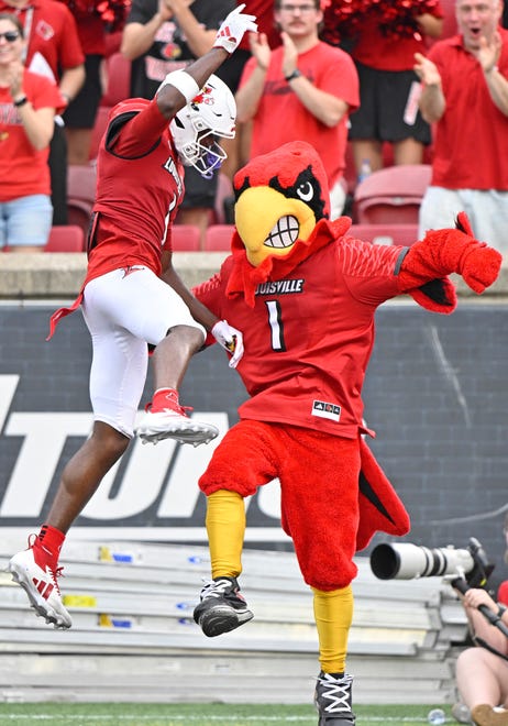 Sep 21, 2024; Louisville, Kentucky, USA; Louisville Cardinals wide receiver Ja'Corey Brooks (1) celebrates a touchdown with the mascot during the second half against the Georgia Tech Yellow Jackets at L&N Federal Credit Union Stadium. Mandatory Credit: Jamie Rhodes-Imagn Images