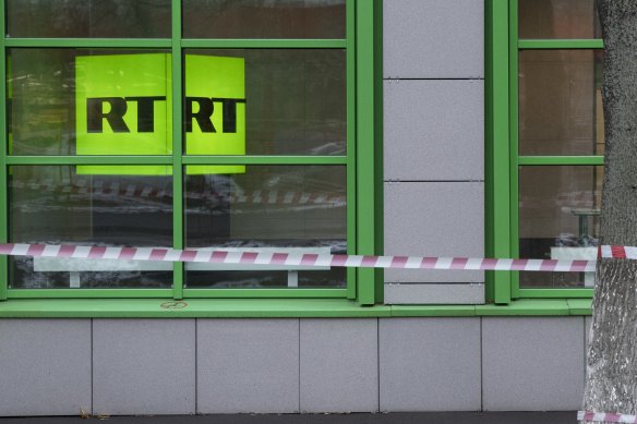 The US has charged two Russia-based employees of RT, its state-controlled propaganda outlet.