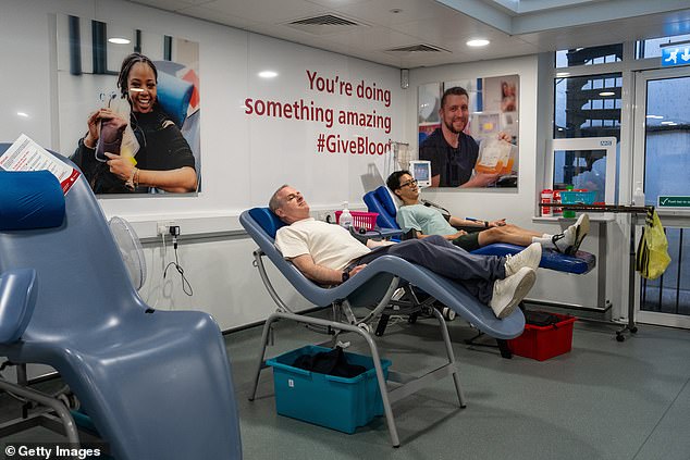 Above, two men donating blood this July at the West End Donor Centre in London, England