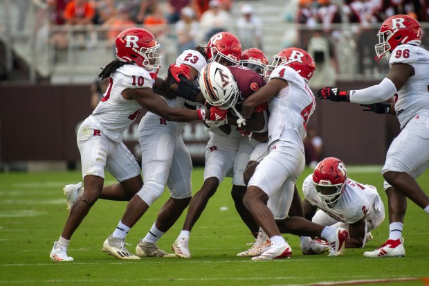 Virginia Tech's Da'Quan Felton runs the ball against Rutgers' Tyreem Powell (22) during the second half of an NCAA college football game, Saturday, Sept. 21, 2024, in Blacksburg, Va. (AP Photo/Robert Simmons)