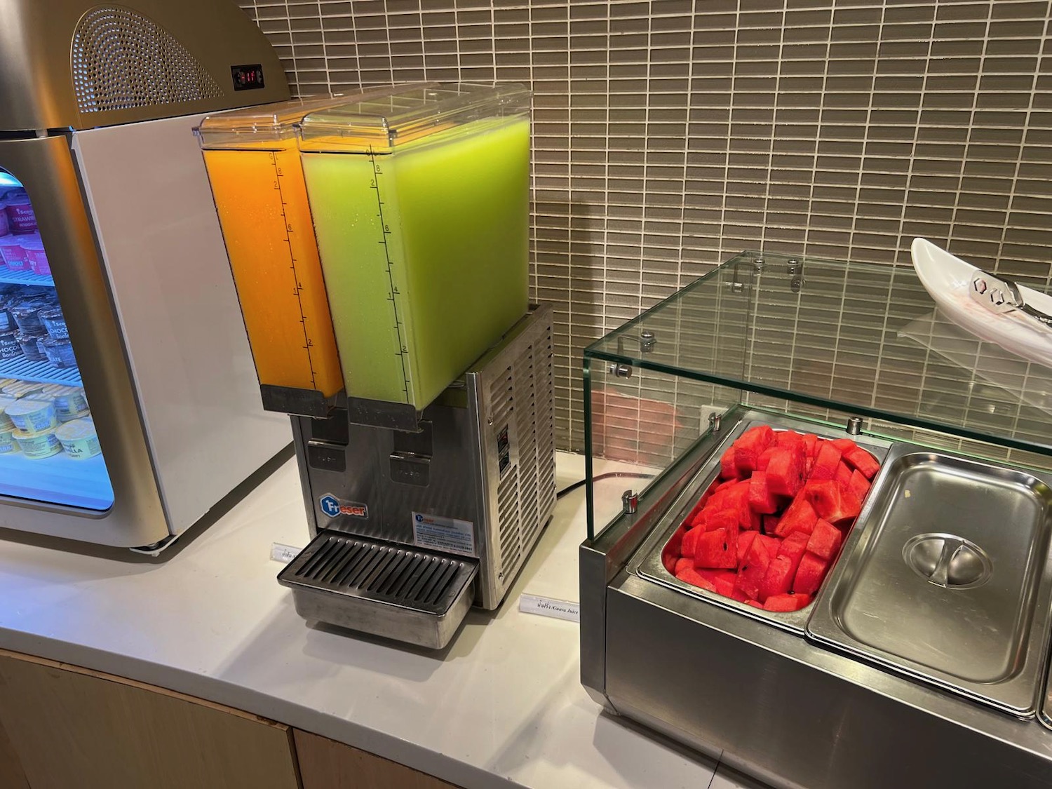 a machine with a container of fruit in it