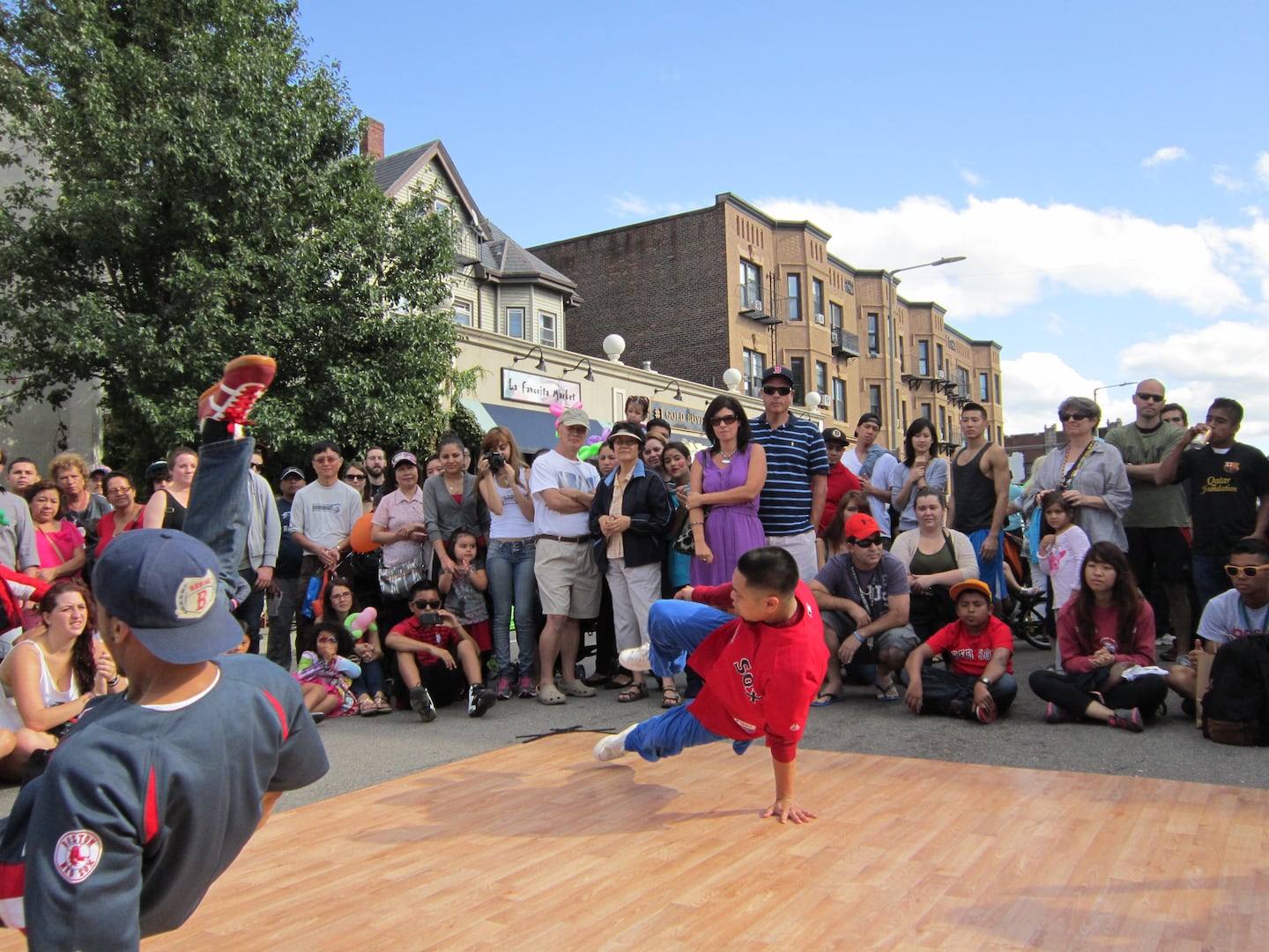 A crowd enjoys breakdancing at a past Allston Village Street Fair festival.