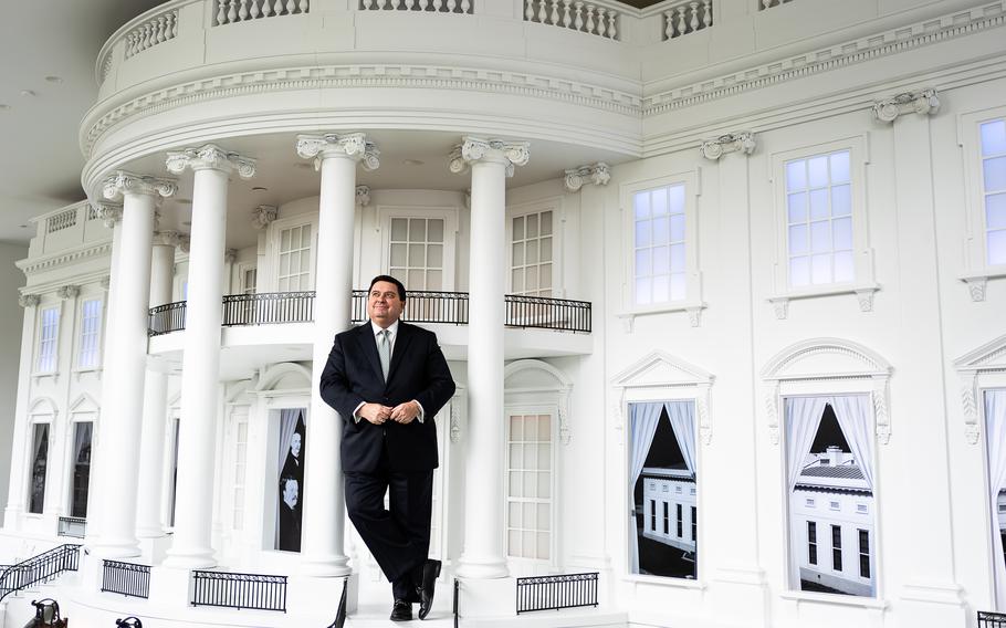 Stewart D. McLaurin, president of the White House Historical Association, in front of a model of the White House at the new museum. The WHHA created the museum. 