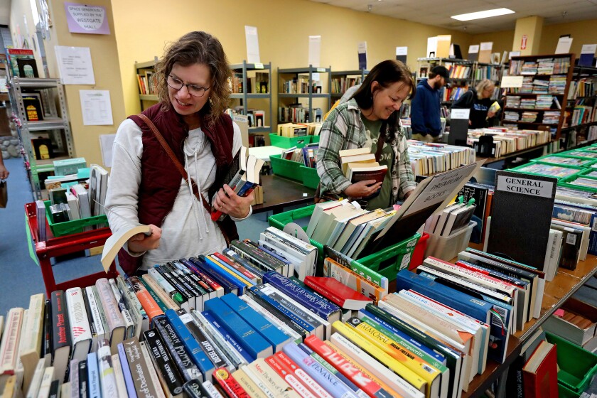 People browse through books Wednesday, Oct. 23, 2024, during the Friends of the Brainerd Public Library Book Sale at the Westgate Mall. The book sale wraps up 6 p.m. on Thursday.