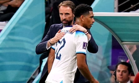 England’s Jude Bellingham is given a hug by Gareth Southgate.