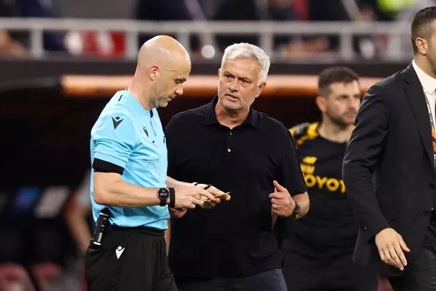 Referee Anthony Taylor looks on with Jose Mourinho, Head Coach of AS Roma, during the UEFA Europa League 2022/23 final match between Sevilla FC and AS Roma at Puskas Arena on May 31, 2023 in Budapest, Hungary.