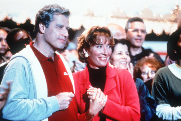 John Travolta and Emma Thompson in Primary Colors.