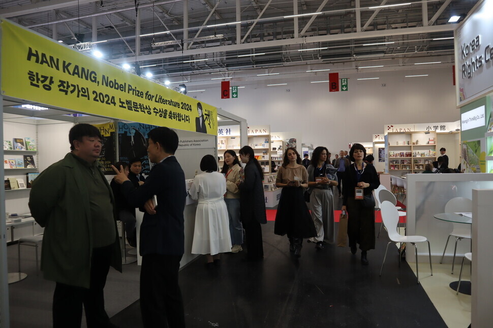 A banner congratulating Han Kang on her Nobel Prize in literature hangs from the Korean booth at the book fair on Oct. 17, 2024. (Jang Ye-ji/Hankyoreh)