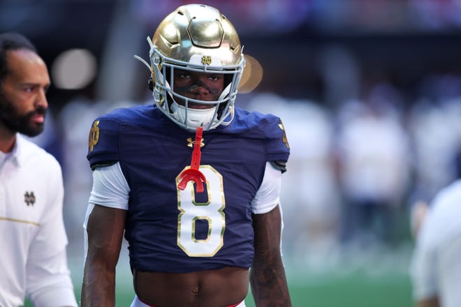 Oct 19, 2024; Atlanta, Georgia, USA; Notre Dame Fighting Irish safety Adon Shuler (8) walks off the field before a game against the Georgia Tech Yellow Jackets at Mercedes-Benz Stadium. Mandatory Credit: Brett Davis-Imagn Images