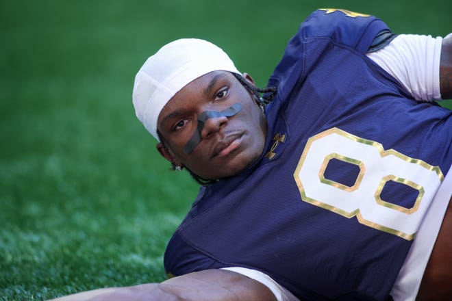 Oct 19, 2024; Atlanta, Georgia, USA; Notre Dame Fighting Irish safety Adon Shuler (8) stretches before a game against the Georgia Tech Yellow Jackets at Mercedes-Benz Stadium. Mandatory Credit: Brett Davis-Imagn Images