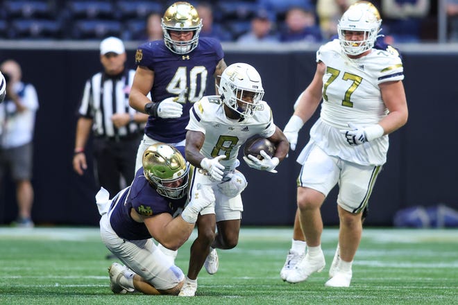 Oct 19, 2024; Atlanta, Georgia, USA; Georgia Tech Yellow Jackets wide receiver Malik Rutherford (8) runs after a catch against the Notre Dame Fighting Irish in the first quarter at Mercedes-Benz Stadium. Mandatory Credit: Brett Davis-Imagn Images