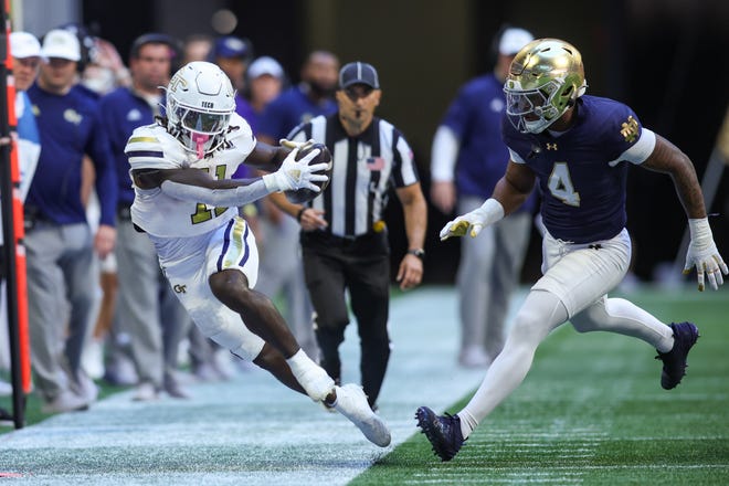 Oct 19, 2024; Atlanta, Georgia, USA; Georgia Tech Yellow Jackets running back Jamal Haynes (11) is pushed out of bounds by Notre Dame Fighting Irish linebacker Jaiden Ausberry (4) in the first quarter at Mercedes-Benz Stadium. Mandatory Credit: Brett Davis-Imagn Images