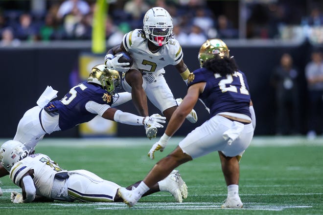 Oct 19, 2024; Atlanta, Georgia, USA; Georgia Tech Yellow Jackets wide receiver Eric Singleton Jr. (2) runs the ball against the Notre Dame Fighting Irish in the first quarter at Mercedes-Benz Stadium. Mandatory Credit: Brett Davis-Imagn Images