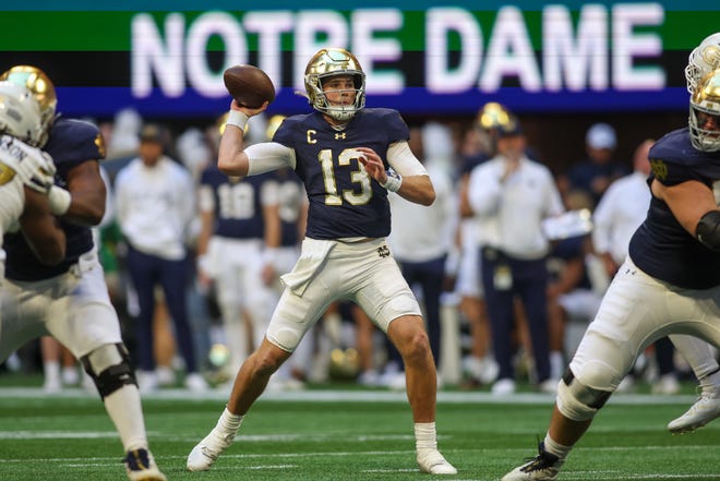 Oct 19, 2024; Atlanta, Georgia, USA; Notre Dame Fighting Irish quarterback Riley Leonard (13) throws a pass against the Georgia Tech Yellow Jackets in the second quarter at Mercedes-Benz Stadium. Mandatory Credit: Brett Davis-Imagn Images