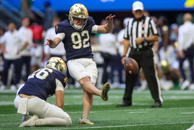 Oct 19, 2024; Atlanta, Georgia, USA; Notre Dame Fighting Irish place kicker Zac Yoakam (92) kicks an extra point against the Georgia Tech Yellow Jackets in the second quarter at Mercedes-Benz Stadium. Mandatory Credit: Brett Davis-Imagn Images