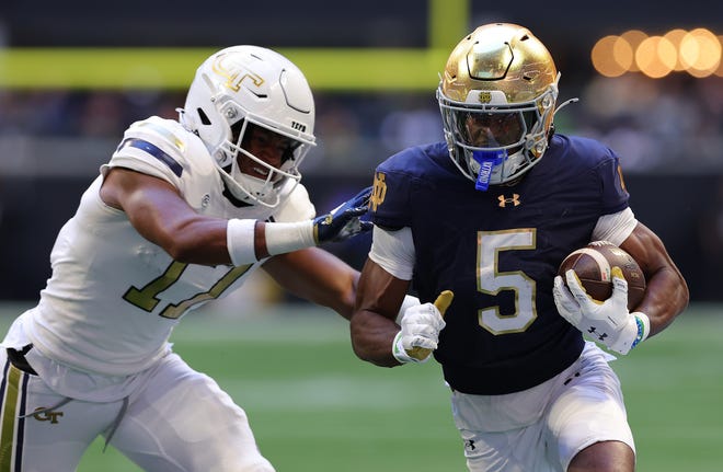 ATLANTA, GEORGIA - OCTOBER 19: Beaux Collins #5 of the Notre Dame Fighting Irish rushes this reception against Jackson Hamilton #17 of the Georgia Tech Yellow Jackets during the second quarter at Bobby Dodd Stadium on October 19, 2024 in Atlanta, Georgia. (Photo by Kevin C. Cox/Getty Images)