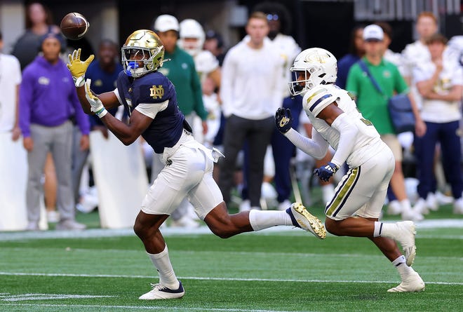 ATLANTA, GEORGIA - OCTOBER 19: Beaux Collins #5 of the Notre Dame Fighting Irish pulls in this reception against Ahmari Harvey #3 of the Georgia Tech Yellow Jackets during the first quarter at Bobby Dodd Stadium on October 19, 2024 in Atlanta, Georgia. (Photo by Kevin C. Cox/Getty Images)