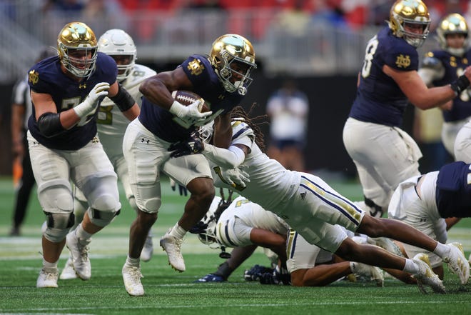 Oct 19, 2024; Atlanta, Georgia, USA; Notre Dame Fighting Irish running back Jadarian Price (24) runs the ball against the Georgia Tech Yellow Jackets in the fourth quarter at Mercedes-Benz Stadium. Mandatory Credit: Brett Davis-Imagn Images