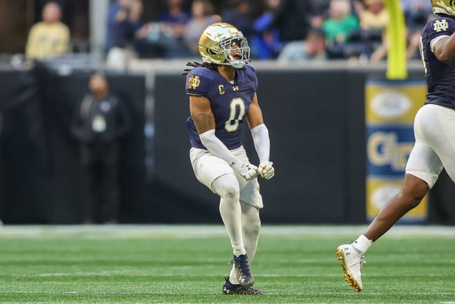 Oct 19, 2024; Atlanta, Georgia, USA; Notre Dame Fighting Irish safety Xavier Watts (0) celebrates after an interception against the Georgia Tech Yellow Jackets in the fourth quarter at Mercedes-Benz Stadium. Mandatory Credit: Brett Davis-Imagn Images