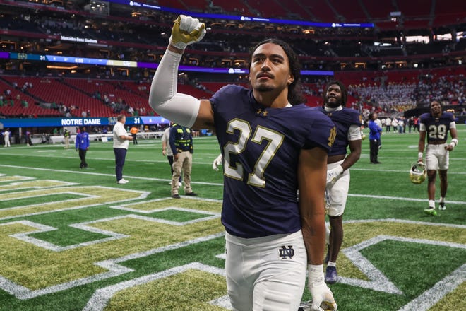 Oct 19, 2024; Atlanta, Georgia, USA; Notre Dame Fighting Irish linebacker Kyngstonn Viliamu-Asa (27) celebrates after a victory over the Georgia Tech Yellow Jackets at Mercedes-Benz Stadium. Mandatory Credit: Brett Davis-Imagn Images