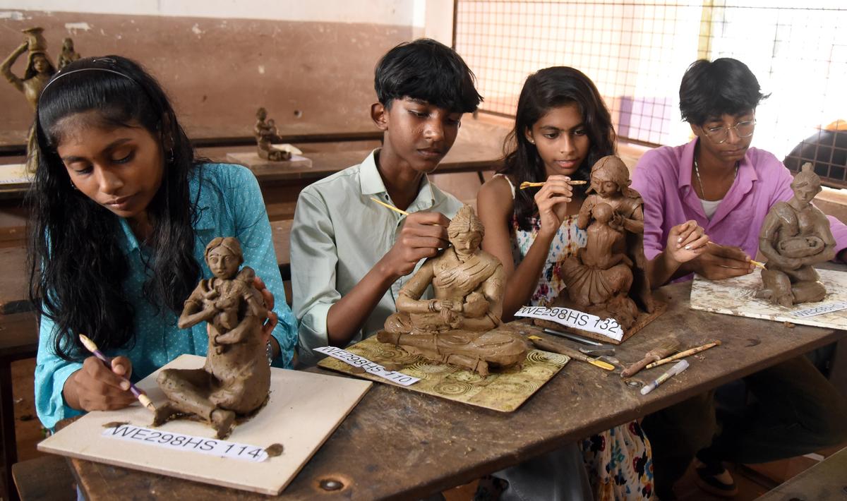 C.P. Vyga, Crescent HSS, Vanimel; K. Siva Soorya, KPESHS, Kayakkodi; Sreenanda R. Anoop, Government HSS, Narikkuni; and K.T.R. Ebin, RAC HSS, Katameri, engaged in clay modelling.