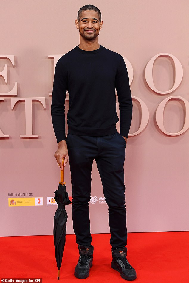 Alfred Enoch looked effortlessly stylish in an all black ensemble