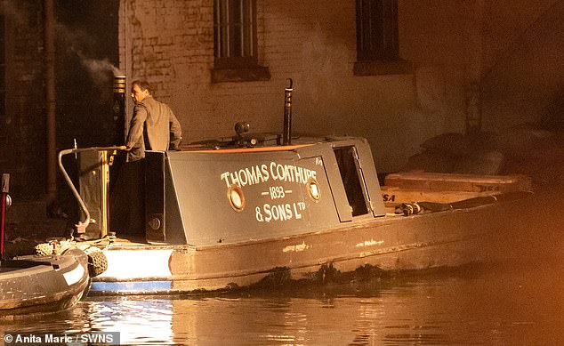 The British actor, 51 was snapped onboard a narrowboat dressed in period costume outside the Tap and Spile pub on Monday night