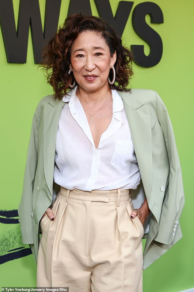 The Emmy-winning Killing Eve alum had her auburn wavy locks parted to the side and accessorized with hoop earrings