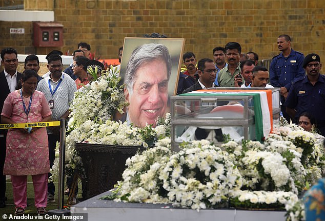 People attend the funeral ceremony of Indian business tycoon Ratan Tata