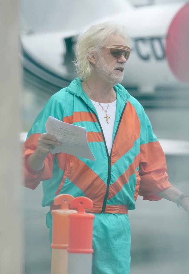 That's right, it's Bob Geldof! He looked worlds away from his normal look as he cut a vibrant figure in a bright orange and blue shell suit as he channelled 90s fashion