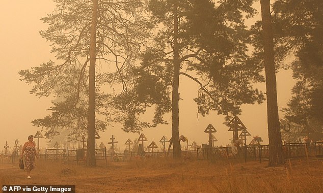 Russia's heatwave of summer 2010 saw monthly temperatures more than 9°F (5°C) above average. Pictured, Beloomut in a deep smoke, about 80 miles from Moscow on July 31, 2010. Research shows that changes in climate create warmer, drier conditions, boosting chances of wildfires