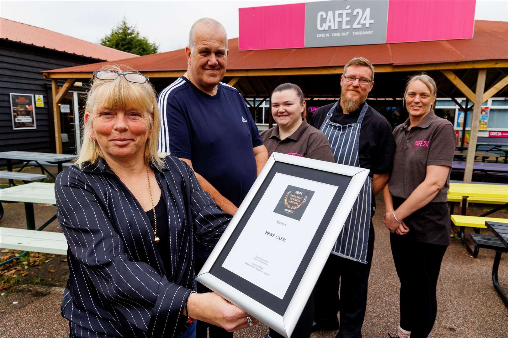 Sarah, Rob and Chloe Shaw, Michael Hay and Tracy Leach show off their award. Picture: Mark Bullimore