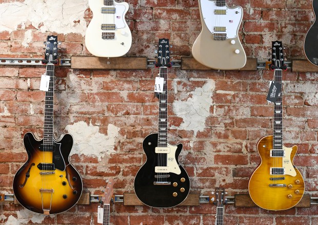 Electric guitars sit for sale on the wall of the new Greeley Guitar Lounge business at 811 8th St. in Greeley on Friday Oct. 25, 2024. The business in open 7 days a week from 11am-7pm.(Jim Rydbom/Staff Photographer)