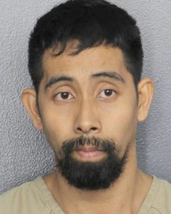 Portrait of Arvin Joseph Mirasol, 34-year-old cabin attendant on a Royal Caribbean cruise ship with a beard