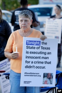 Ann Dorn, a local Catholic parishioner opposed to the death penalty, joins a protest outside the prison where Robert Roberson was scheduled for execution at the Huntsville Unit of the Texas State Penitentiary on Oct. 17, 2024.