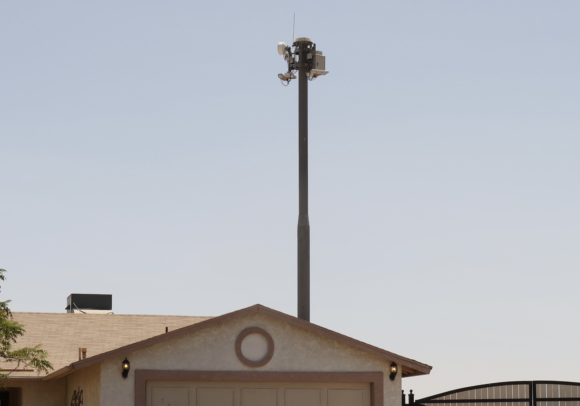 A surveillance tower over a home.