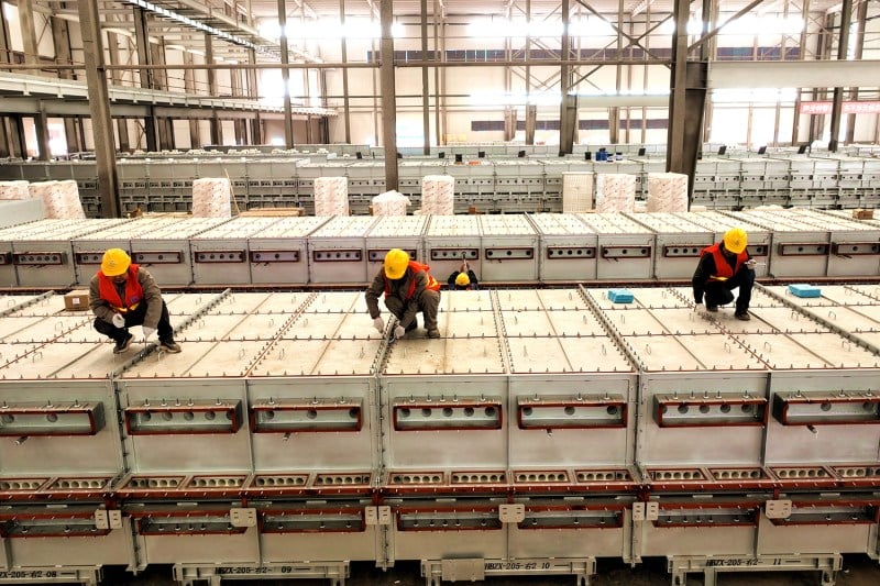 Workers are busy at the construction site of a lithium battery plant in Meishan City, China on April 6.