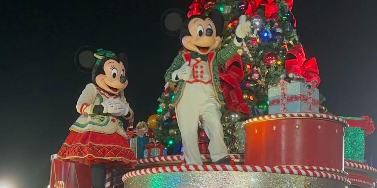 Minnie Mouse and Mickey Mouse are dressed in festive holiday costumes during Mickey's Once Upon A Christmastime Parade at Mickey's Very Merry Christmas Party in Magic Kingdom at Walt Disney World Resort.