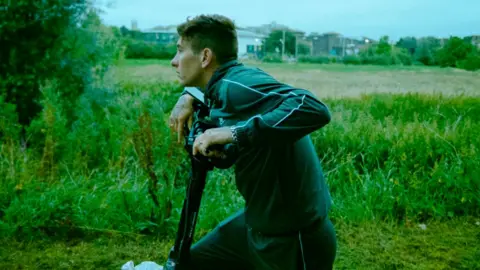 Mubi Barry Keoghan as Bug in Bird, pictured riding a scooter