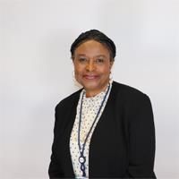 Headshot of Grace-Toks Macaulay. Grace-Toks is wearing a white top and black jacket.