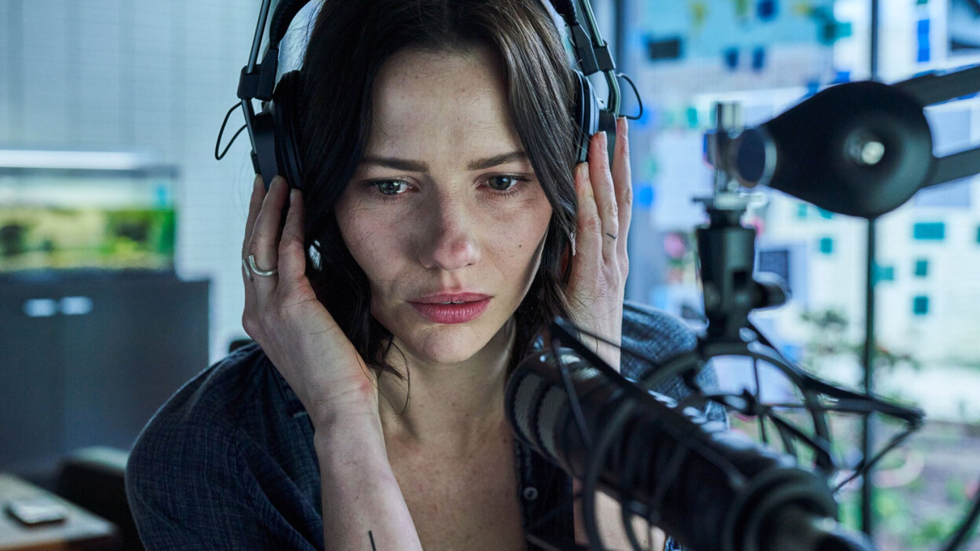 A woman records in an at-home studio in the film 